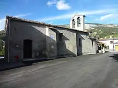 Église Saint-Laurent, avec cadran solaire peint.