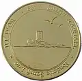 Médaille dorée représentant une tour sur une île.