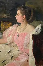 Portrait d'une femme assise de profil.