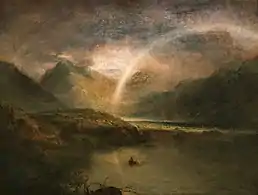 Paysage montagneux, nuageux, avec un lac, traversé par un arc-en-ciel
