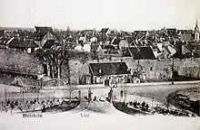 Photographie ancienne en noir et blanc d'une petite ville alsacienne.