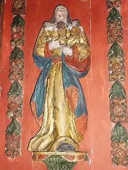 Plougastel-Daoulas : chapelle Saint-Guénolé, retable de saint Louis, statue de sainte Gwenn allaitant ses trois enfants.