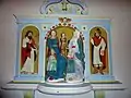 Retable en bois polychrome représentant sainte Anne, la Vierge et l’enfant Jésus accompagnés de saint Joseph et de saint Joachim.
