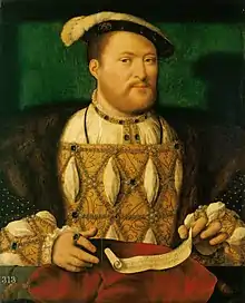 Portrait d'un homme joufflu avec une courte barbe rousse. Il porte un ample manteau ordé de joyaux avec des brodures dorées