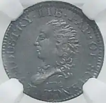 Pièce de monnaie représentante un buste de femme, tournée vers la gauche.