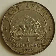Pièce d’un shilling est-africain, frappée en 1925, revers, argent.