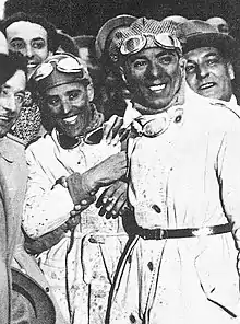 Photo de Tazio Nuvolari et Battista Guidotti à l'arrivée des Mille Miglia 1930.