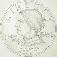 Dessin d'une pièce de monnaie représentant le profil gauche d'une femme et les inscriptions Susan B. Anthony, Liberty, In God We Trust et 1979.