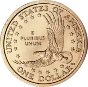 Pièce de monnaie représentant un aigle en vol, entouré d'étoiles et les inscriptions UNITED STATES OF AMERICA, One dollar et E Pluribus Unum.