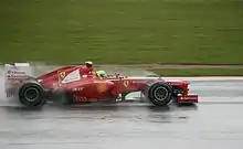 Massa sur sa Ferrari en 2012, à Silverstone, sous une pluie battante.