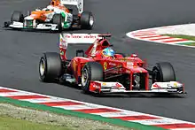 Photographie de Fernando Alonso et Paul di Resta lors de la deuxième session de qualification