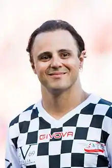 Felipe Massa, homme brun aux yeux marron, souriant, vu de face, en gros plan.