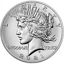 Pièce de monnaie représentant le profil gauche d'une femme aux cheveux longs, portant une couronne et les inscriptions LIBERTY, IN GOD WE TRUST ET 1964.
