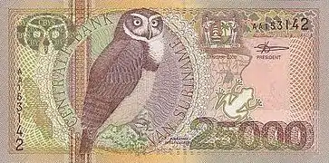 Pulsatrix perspicillata sur un billet de 25 000 Suriname Banknote