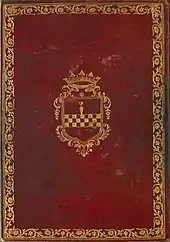 Couverture de livre en cuir rouge, avec une bordure dorée et un blason au centre.