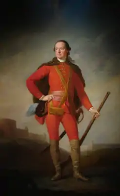 Portrait en pied d'un homme en uniforme rouge