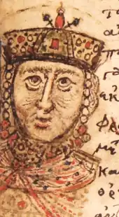 Photographie du portrait d'un homme couronné sur la page d'un manuscrit.