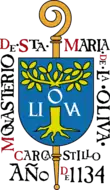 Sceau montrant une crosse surmontée d'un écu frappé d'un olivier, et entouré du texte « Monasterio de Sta Maria de La Oliva — Carcastrilo — Año 1134.