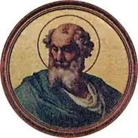 Portrait en médaillon d'un homme âgé avec une longue barbe grise, dont le crâne dégarni est entouré d'une auréole