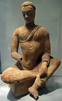 Buddha assis en délassement royal. Vallée de Ghorband, Monastère de Fondukistan. VIIe siècle. Musée Guimet.