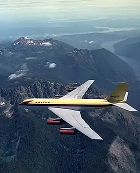 Le Dash 80 passe au-dessus de la péninsule Olympique, dans l'État de Washington ; le lac Cushman, le Puget Sound et le mont Rainier sont visibles en arrière-plan.