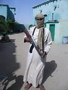 Un djihadiste d'AQMI dans le nord du Mali, en 2012[réf. nécessaire], armé d'un fusil Type 56.