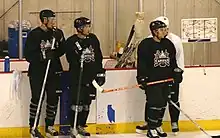 Photographie de quatre joueurs des Capitals à l'entraînement