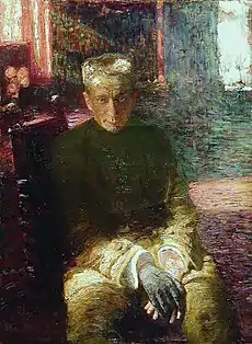 Portrait d'un homme assis, taciturne, sur un fond très coloré.