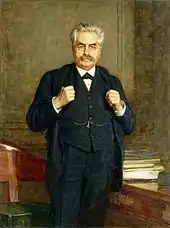 Huile sur toile d'un homme aux cheveux grisonnants, moustachu, lorgnons sur le nez, se tenant debout dans un bureau, les mains sur les revers de son costume trois pièces