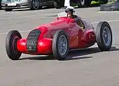 Photographie d'une Alfa Romeo 308 en démonstration à Goodwood, en 2012.