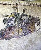 Fresque endommagée représentant deux femmes à cheval