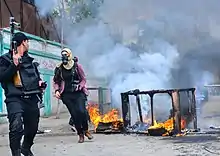 La photographe de presse Heba Khamis lors d'affrontements entre la police égyptienne et les Frères musulmans dans la région de Sidi Bishr à Alexandrie en Égypte.