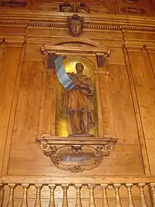 Photo d'une statue en bois d'Hippocrate dans le théâtre anatomique de Bologne.