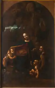 Tableau en couleur. Dans un cadre de rochers, une femme est entourée de deux bébés nus. L'un est agenouillé l'autre est assis. Un personnage habillé et ailé regarde l'observateur.