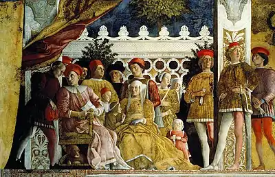 Peinture représentant une dizaine de personnages aux costumes d'époque médiéval ou renaissance. Une naine, à côté de Barbara de Brandebourg, est vêtue d'une robe rouge et porte sur les cheveux un fichu blanc.