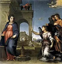 Peinture. L'ange, à droite, accompagné de deux anges, salue Marie placée devant un bâtiment.
