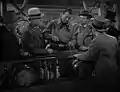 L'Ange et le Mauvais Garçon (1947), avec Pat Flaherty et Wade Crosby (chapeau melon gris) entourant John Wayne