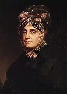Portrait d'une femme vêtue de noire et portant un foulard sur la tête