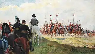Napoléon de dos, suivi de ses officiers, acclamé par des lanciers vêtus de rouge et de bleu.