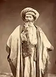 Homme arabe fumant la pipe, fin des années 1800.