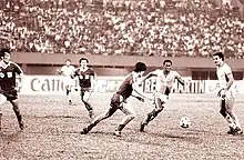 Photo sepia du match entre la Chine et l'Arabie saoudite en 1984