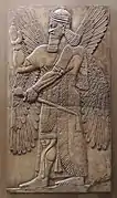 Relief assyrien représentant un esprit ailé dans une pose de bénédiction