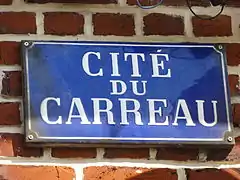 Panneau de rue indiquant la cité du Carreau.