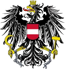 Bundesadler de la république d'Autriche depuis 1945 ; le même dessin ayant été utilisé de 1919 à 1934, mais sans les chaînes brisées symbolisant la fin du fascisme, lesquelles ont été ajoutées en 1945.