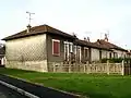 'Béguinage' avec 14 petits logements pour retraités de la cartoucherie, côté jardin (où quatre logements, aux extrémités et au centre, avaient leurs entrées), rue d'Enfresne.