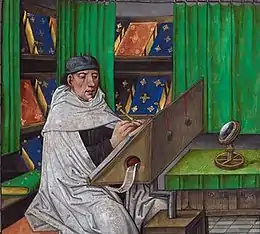 Image en couleurs montrant un moine occupé à écrire