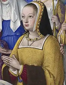 Miniature représentant une femme en buste, mains jointes, vêtues d'un manteau jaune.