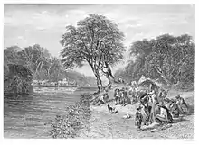 un groupe de personnes au bord d'une rivière.