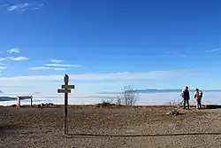 Mer de nuages depuis l'esplanade de la gare supérieure de l'ancien téléphérique, détruite en 2001.