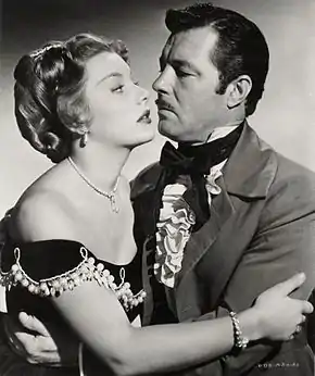 Avec James Craig, dans Le Rocher du diable (1951, photo promotionnelle)